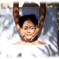 A person receiving bodywork outdoors